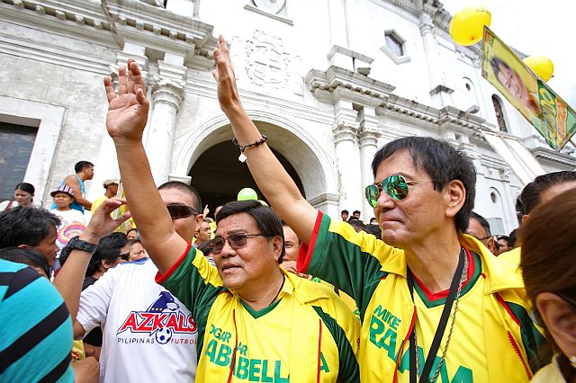 TEAM RAMA FILE THEIR COC'S/OCT. 16, 2015: Cebu City mayor Machael Rama and Vice mayor Edgardo Labella wave to ther hundreds of supporters after attending the mass with their congressional and councilorial slates in Cebu Metropolitan Cathedral before proceding to the Cebu City Comelec office to file their certificate of Candidacy.(CDN PHOTO/JUNJIE MENDOZA)