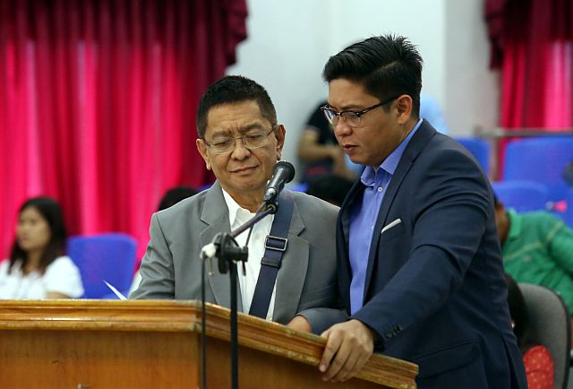 PB SESSION/OCT. 19, 2015: board member Arleigh Sitoy (left) and Celestino Martines III approach the pudium during the provincial board regular session yesterday afternoon. Pb sitoy is suppose to deliver his priviledge speech alledgely to formally announce his resignation as majirity floor leader but it was deffered.(CDN PHOTO/JUNJIE MENDOZA)