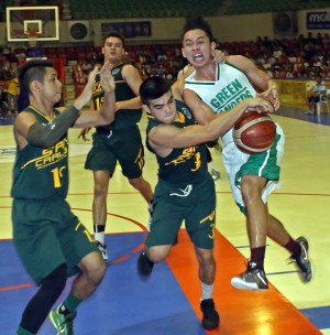 Christian Maconocido of USC holds on to UV’s Jun Manzo in Game 2 of the Cesafi men’s basketball finals at the Cebu Coliseum.  CDN PHOTO/LITO TECSON