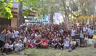 Youth camp participants with the brothers and sisters of St. John Community.  (CONTRIBUTED)