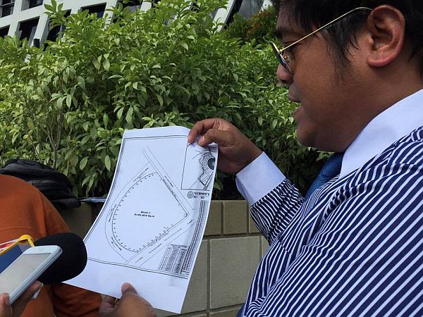 DPWH legal council Brando Raya showed a copy of the SM Seaside City mall's building plan.