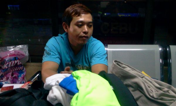 Taiwanes national Chao-Ching Hung, 35, had a KG 9 submachine pistol, a 9 mm Berreta and live bullets and magazines in his roller bag when it passed through the X-ray machine. A lead blanket shielded the deadly weapons from the X-ray. (CDN PHOTO/NORMAN MENDOZA)
