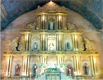 The image of Nuestra Señora Patrocinio de Maria (center) standing with other images at the convent of Boljoon Church.