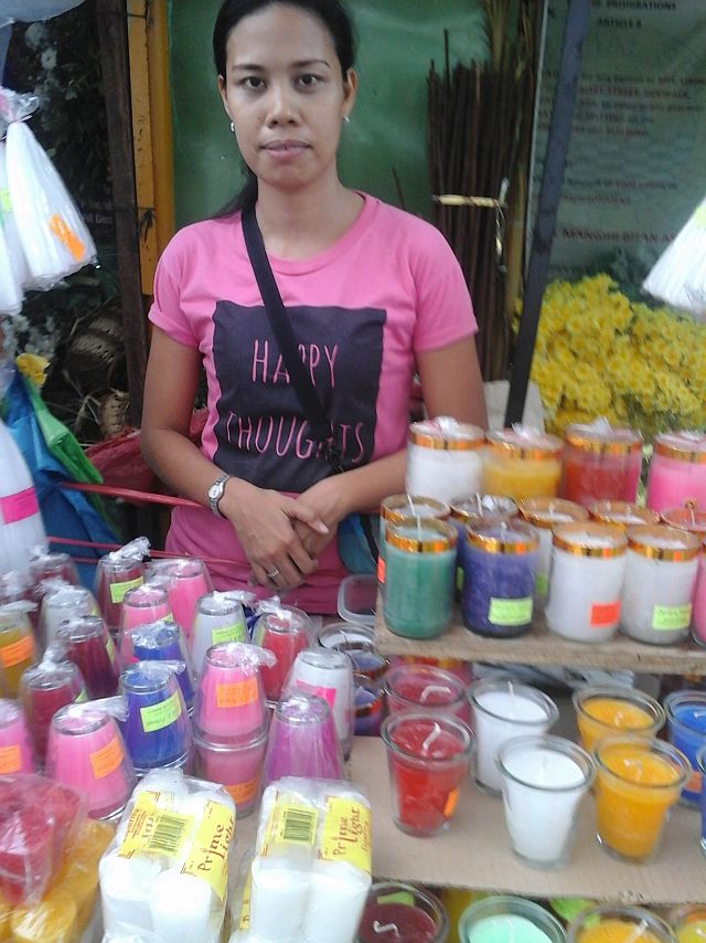 Jenesses Caramelo and the colored candles at Freedom Park in Cebu City. / CDN Photo Michelle Joy L. Padayhag