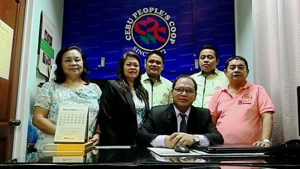 Cebu People's Multipurpose Cooperative chief executive officer Macario Quevedo (seated) with fellow co-op officers. 