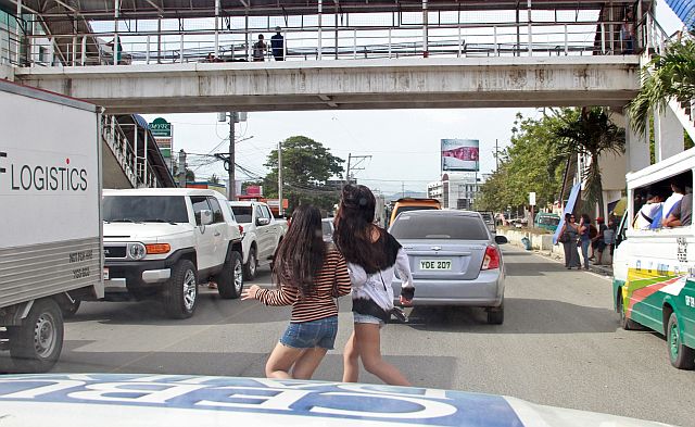 SILOY IS WATCHING: The Cebu Daily News service vehicle immediately stop after this two ladies immediately cross the road with out using the Skywalk at A.C. Cortes Ave. Mandaue City that cuase danger. ATTENTION: UCLM OFFICIALS AND TEAM ENFORCERS