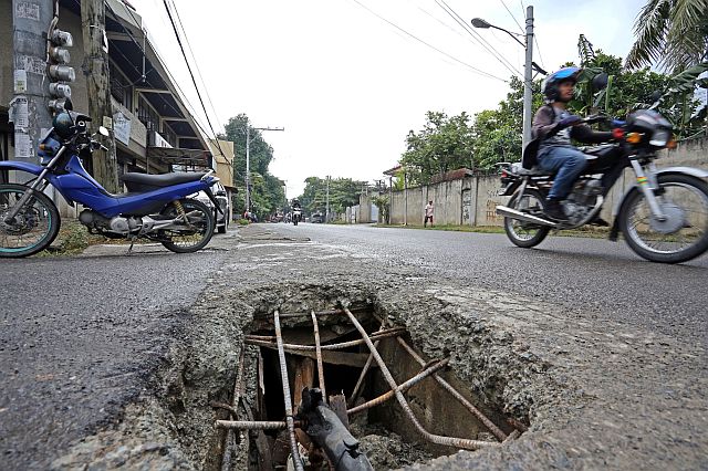 SILOYS WATCHING GEN ECHAVEZ COLLAPSE SLUB/NOV.24,2015:These collapse concrete slub is very dangerous to motorist whos passing the area in Gen Echavez street.Attention any Government office whos handling the repair.(CDN PHOTO/LITO TECSON)