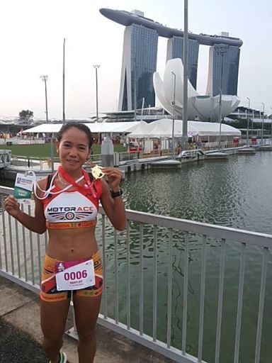 Cebuana Mary Joy Tabal shows off her medal after finishing fourth in the Great Eastern Women's Run in Singapore.