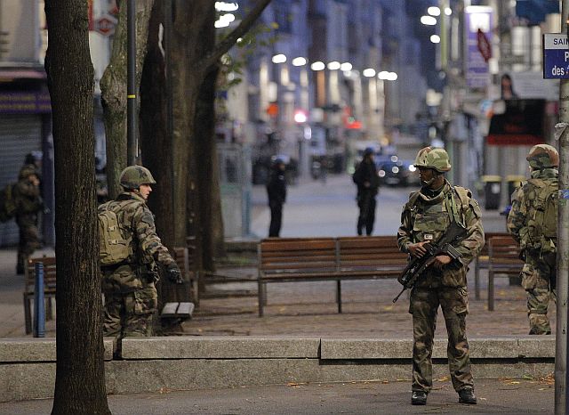 Soldiers patrol in St. Denis, a northern suburb of Paris. (AP PHOTO)