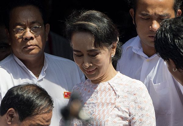 Suu Kyi leaves her party headquarters after delivering a speech to her supporters in Yangon, Myanmar. (AP Photo)