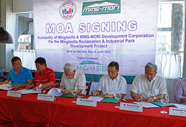 In this June 26, 2013 photo, (from left) Minglanilla Councilor Robert John Selma, Minglanilla Vice Mayor Elanito Pena and Minglanilla Mayor Eduardo Selma sign the agreement with Ming-Mori Development Corp. Chairman and President Joe Soberano and Ming-Mori Development Corp. Vice Chairman and Vice President Ricardo King for the Minglanilla reclamation and industrial park development project.