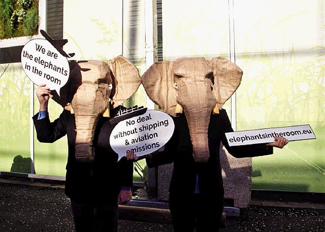 NGO representatives wear elephant masks and hold banners at the United Nations Climate Change Conference in Le Bourget, north of Paris. (AP PHOTO)