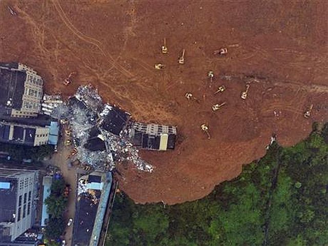 Rescue workers search for survivors in the aftermath of a landslide in Shenzhen in southern China’s Guangdong province in this photo taken from a drone-mounted camera. (AP PHOTO)