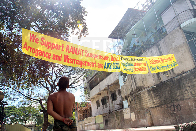 Anti-Rama streamers are hung in Capitol Site where houses were demolished. (CDN PHOTO/LITO TECSON)