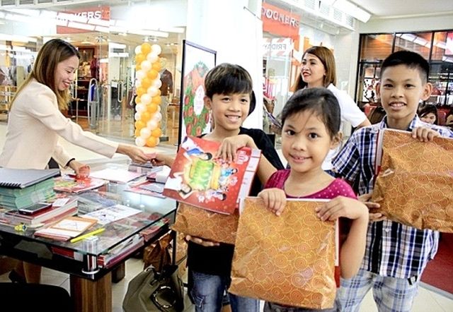 Children of overseas Filipino workers receive kiddie loot bags during the OFW Family Day at The Terraces in Ayala Center Cebu.