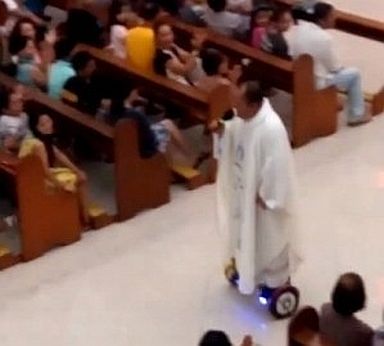 A priest uses a hoverboard while presiding a Mass. (TAKEN FROM GOOGLE)