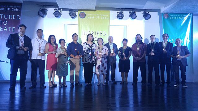 he twelve Tatak UP Cebu Awardees, with their trophies shaped after the iconic Oblation.(CDN PHOTO/JULI ANN SIBI)