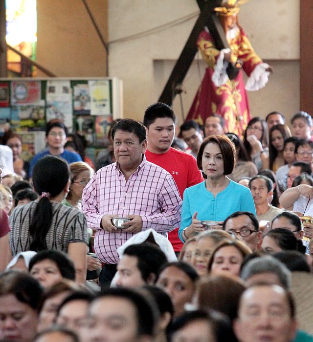GUADALUPE FIESTA MASS/DEC. 12, 2015: Former Cebu City South District Congressman Tomas Osmeña his wife Councilor Margot and 1st District congressman Samsam Gullas (back to the Osmeña's in red shirt) prepare for the offering to Cebu Archbishop Jose Palma during the Pontifical mass in honor of  Our Lady of Guadalupe fiesta in the Archdiocesan Shrine of Our Lady of Guadalupe. (CDN PHOTO/JUNJIE MENDOZA)