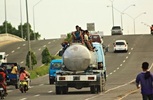 SILOY IS WATCHING: Siloy caught with his camera the non wearing of helmets of motorcycle riding motorists and an overloaded tanker truck topload with hitch hikers passing along SRP road. AUTHORITIES PLEASE DO SOMETHING TO AVOID ACCIDENTS. (JOHN DOMINGO)