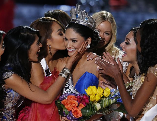 Miss Philippines Pia Alonzo Wurtzbach is congratulated by contestants after she is crowned Miss Universe in Las Vegas on Sunday. (AP Photo/John Locher)
