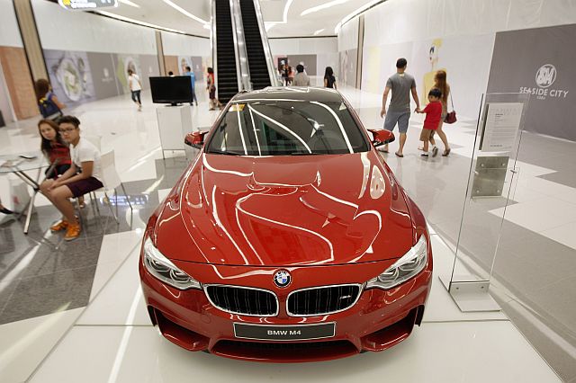 A BMW M4 is displayed at the SM Seaside City Cebu.