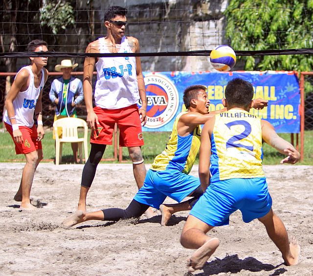 CESAFI 2015 BEACH VOLLEY SEMIS/DEC.05,2015:Tormis and Villaflor of USP-F try to save the ball from Jason Owen and Kent Jay of USJ-R during their game in CESAFI 2015 Beach volley semis at Aznar Coliseum.USJ-R win the game.(CDN PHOTO/LITO TECSON)