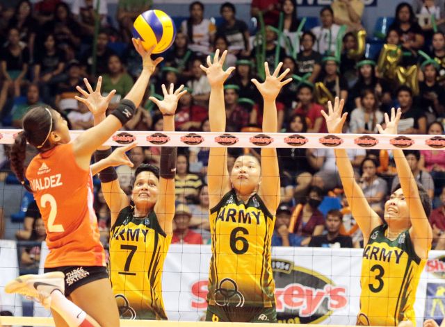 Alyssa Valdez of PLDT Home Ultera is defended by Army's Jennifer Fortuno (7), Mariel Desengano (6) and Norie Jane Diaz (3) in Shakey's V-League Finals.