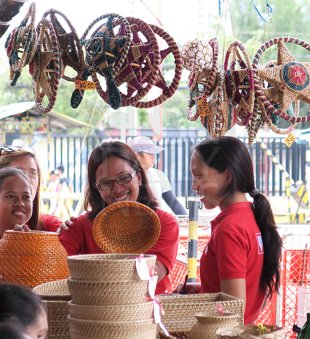 Department of Social Welfare and Development beneficiaries from Tabuelan, northern Cebu display their products during the PaskoJuan Bazaar at the White Gold parking area. (CDN PHOTO/TONEE DESPOJO)