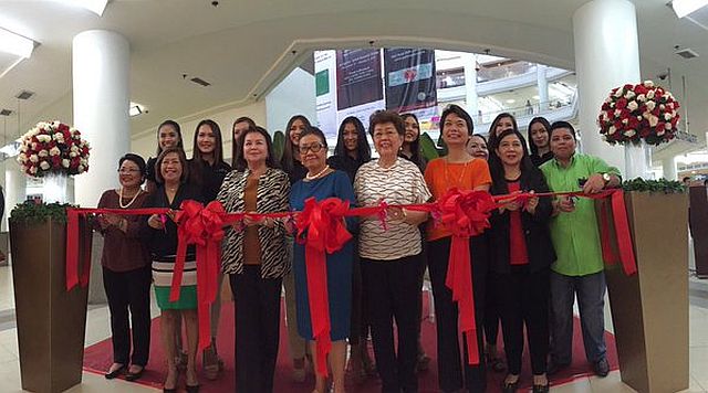 Balik Cebu committee, with honored guests including Cebu Daily News' publisher and acting editor-in-chief Eileen G. Mangubat officially cuts the ribbon to open the Balik Cebu Booth at the Ayala Center Cebu. Joining them are this year's Miss Cebu candidates. (CDN PHOTO/VANESSA CLAIRE LUCERO)