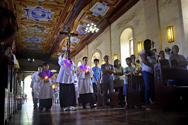 Altar boys lead a procession at the start of a Mass in a church in Panglao, Bohol in this photo by Nathaniel Luperte that won third prize in the IEC Photo Contest. The eucharistic congress opens on Sunday in Cebu City.