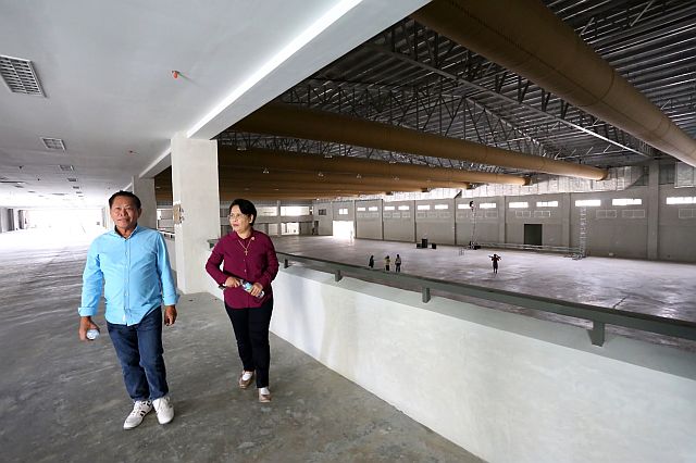Engr. Rafaelito A. Barino and his wife Fe M. Barino of Duros Development Corp. lead the walk through at the International Eucharistic Congress (IEC) Pavilion. This year, the couple targets to do more road and infrastructure projects. (CDN FILE PHOTO)