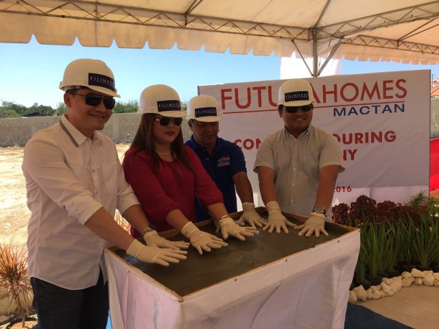 (From left) FLI area sales head and assistant vice president Boler Binamira, Futura Homes sales team head Jeanelley Villaester Cabahug, Bulusan Contractor's James Bulusan, and project development head Archie Igot lead the ceremonial concrete pouring for Futura Homes Mactan. (CDN PHOTO/VANESSA CLAIRE LUCERO)