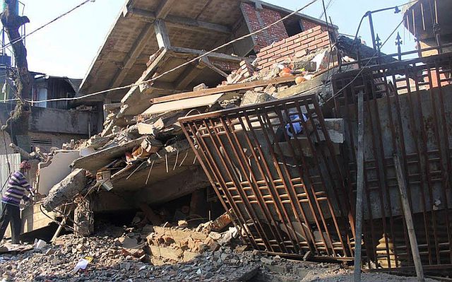 A collapsed building is seen following a strong  quake  in Imphal, northeast India, on Dec. 4, 2015. (AFP PHOTO)