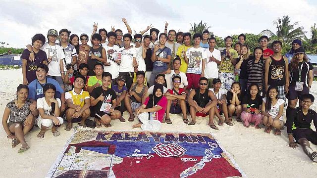 The members of Kalayaan Atin Ito group during their visit to Pagasa Island. (INQUIRER PHOTO)
