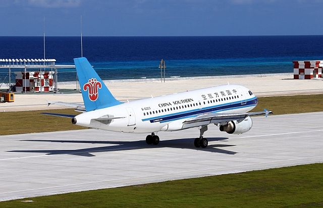 In this Jan. 6 photo released by China’s Xinhua News Agency, a China Southern Airlines jetliner lands at the airfield on Fiery Cross Reef, known as Yongshu Reef in Chinese, in the Spratly Islands. (AP PHOTO)