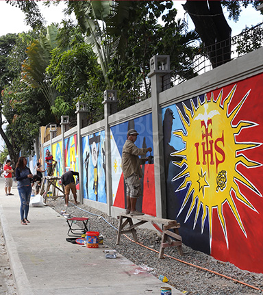 Murals with spiritual themes are painted on the concrete fences of the Mabolo Seminary in Cebu City in the runup to the International Eucharistic Congress. The Pavilion inside is the main venue of the congress. The murals are painted by members of the Cebu Artist Inc. and Portrait Artists Society of the Philippines. (CDN PHOTO/JUNJIE MENDOZA)
