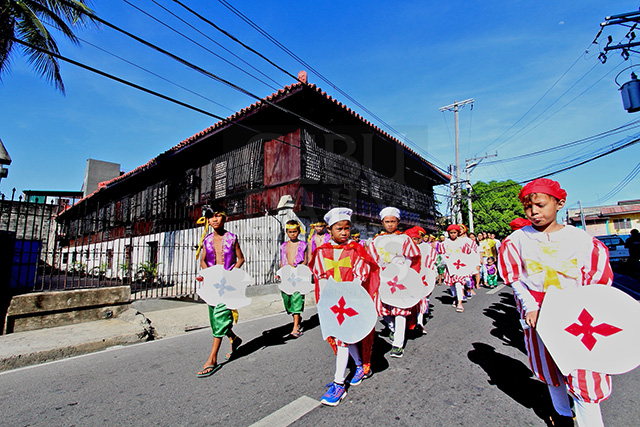 Children from barangay Mabolo perform the original Sinulog dance prayer called "Sinu'g" in front of the Casa Gorordo Museum. The Sinu'g is a legacy of Estrelita "Nang Titang" Diola, who led the dance troupe every year until her death in 2014 at the age of 79.  (CDN PHOTO/TONEE DESPOJO)