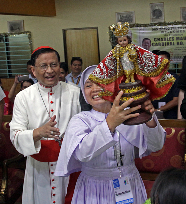 His Eminence Cardinal Charles Maung Bo, SDB, cheers on a nun performing the Sinulog dance during his visit to the Don Bosco Youth Center in Pasil, Cebu City (CDN PHOTO/LITO TECSON)