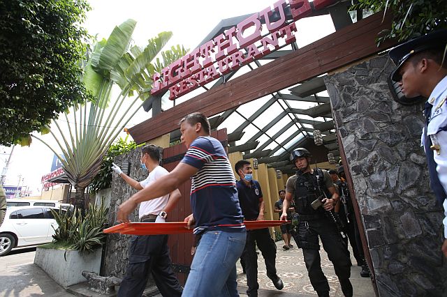 Cebu police and a SWAT team reenact a bizarre  shooting by the retired spouse  of a Chinese diplomat. The new Chinese consul was injured and two other diplomats were killed  at the LightHouse restaurant.