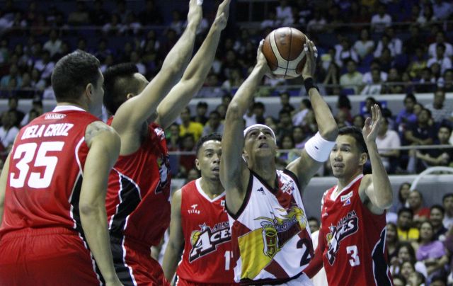 San Miguel Beer's Arwind Santos puts up a shot against four Alaska defenders in Game 2 of the 41st PBA Philippine Cup Finals. (PBA IMAGES)
