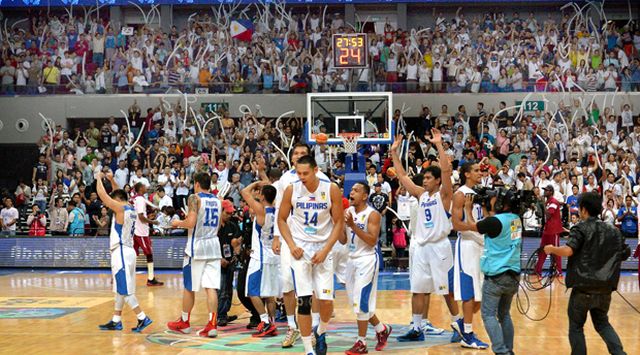 Members of the Gilas Pilipinas National Team celebrate at the Mall of Asia Arena after a victory over Korea in the 2013 Fiba Asia Championship. 