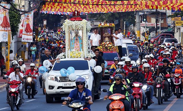 Devotees on motorcycles, bicycles and vehicles join the Traslacion of the images of the  Sto. Niño and Our Lady of Guadalupe from the Basilica del Santo Niño in Cebu City to the National Shrine of St. Joseph in Mandaue City. (CDN PHOTO/JUNJIE MENDOZA)