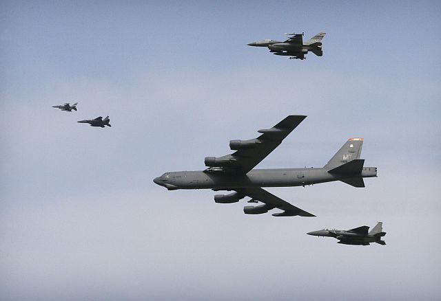A US Air Force B-52 bomber flies over Osan Air Base in Pyeongtaek, South Korea. (AP PHOTO)