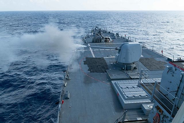 The Arleigh Burke-class guided-missile destroyer USS Curtis Wilbur conducts a live fire gunnery exercise in the South China Sea in this Feb. 15 photo. (AFP PHOTO)
