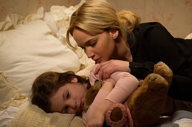 Joy (Jennifer Lawrence) comforts her daughter, Christy, in JOY.