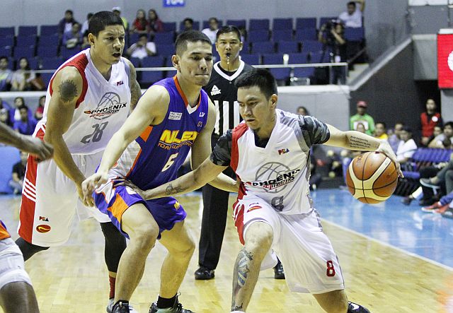 Phoenix’s RR Garcia maneuvers against the defense of NLEX’s Kevin Alas. Garcia scored a career-high 33 points to lead the Fuel Masters’ strong debut in the 41st PBA Commissioner’s Cup. (PBA IMGAES)