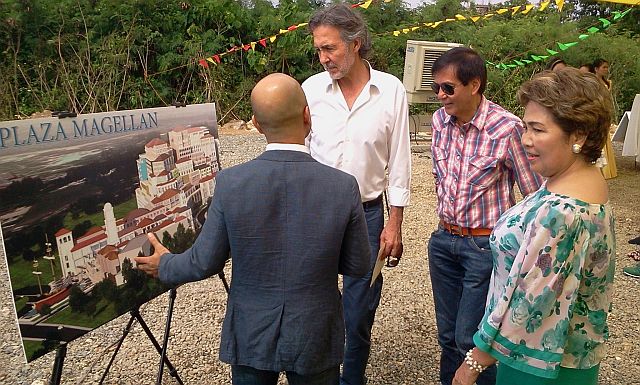 Noli Hernandez of Megaworld shows to a visitor the architectural drawing for Plaza Magellan, as Lapu-Lapu City Mayor Paz Radaza and Cebu City Mayor Michael Rama look on. (CONTRIBUTED PHOTO)