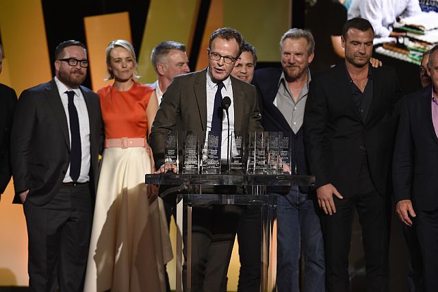 Tom McCarthy, center, and the cast and crew of "Spotlight" accept the Robert Altman award at the Film Independent Spirit Awards on Saturday, Feb. 27, 2016, in Santa Monica, Calif. (Photo by Chris Pizzello/Invision/AP)
