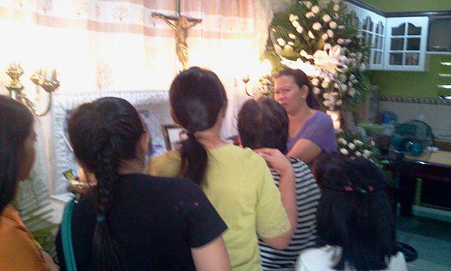 Clarissa Inihao, wife of PO3 Inihao, recieves her relatives at her husband's wake at their residence in Barangay Babag.(CDN PHOTO/NORMAN MENDOZA)