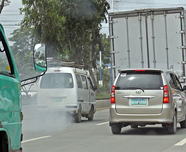 SILOYS WATCHING MULTICAB SMOKE/FEB.17,2016:These multicab emit smoke while travelling the Mandaue City North reclamation area with a foul odor.Attention Mandaue City traffic on these kind of vehicle that pollute the air.(CDN PHOTO/LITO TECSON)